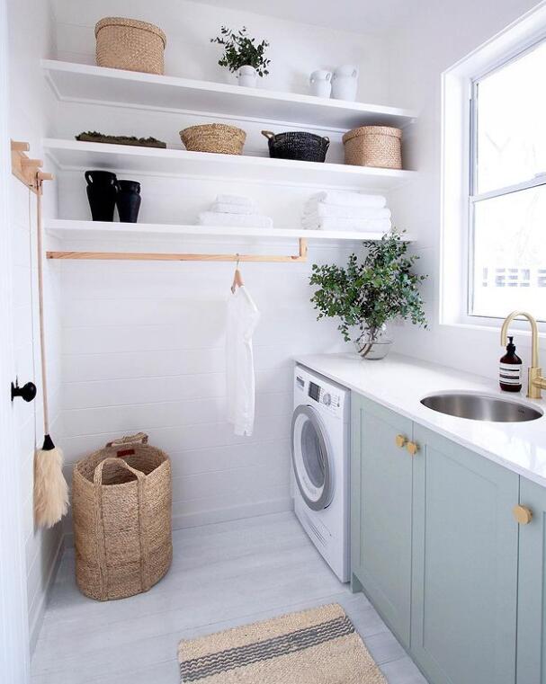 laundry room cabinets and wall shelves and haning rods
